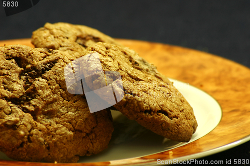 Image of Homestyle chocolate chip cookies on a plate. Shallow DOF.