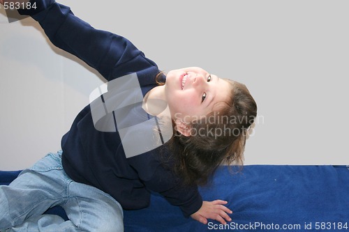 Image of Cute little girl exercising