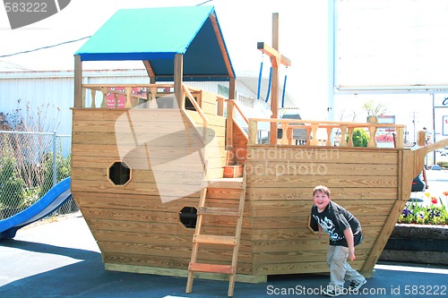 Image of Young boy playing on ship