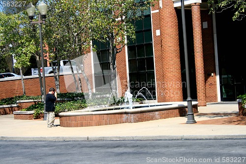 Image of Young boy taking photos
