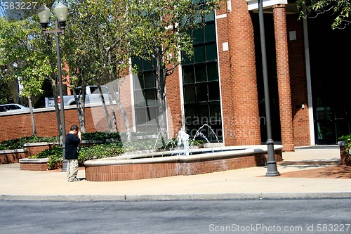 Image of Young boy taking photos