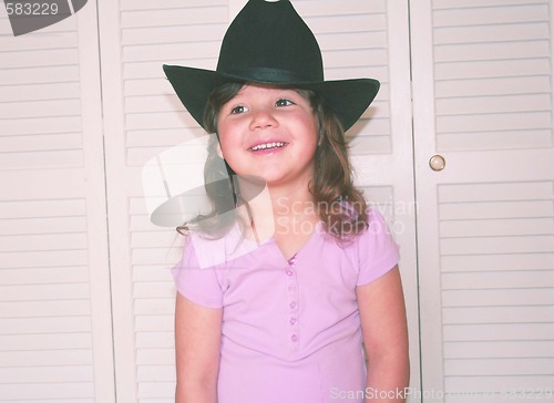 Image of Little girl in black cowgirl hat