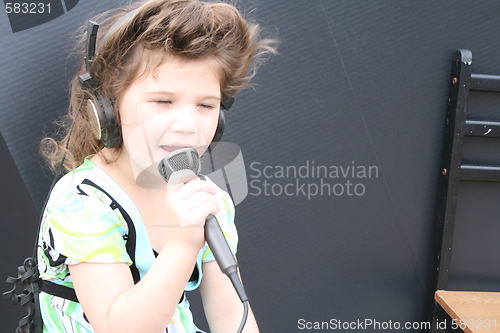 Image of Little girl singing