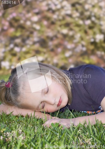 Image of girl sleeping on the grass