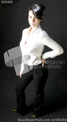 Image of shapely pretty young woman smiling with attitude
