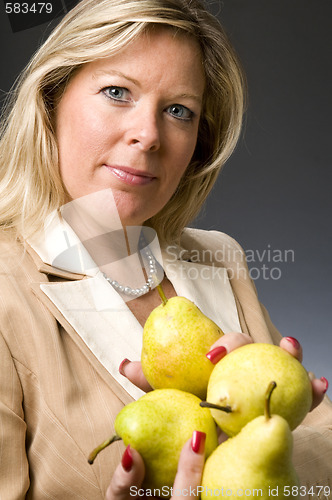 Image of attractive blond woman with pears fruit for healthy life