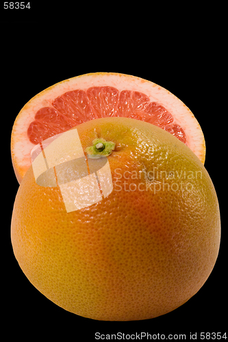 Image of Couple halfs of grapefruit isolated on black background