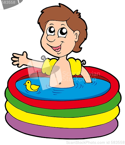 Image of Boy in inflatable pool