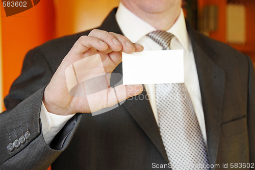 Image of businessman showing business card