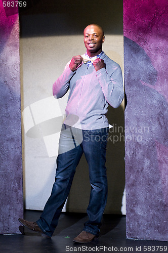 Image of young african american actor on stage theater portrait