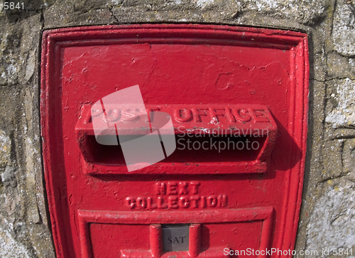 Image of Fisheye lens view of old British hole in the wall red post box, situated in Ely, Cambridgeshire