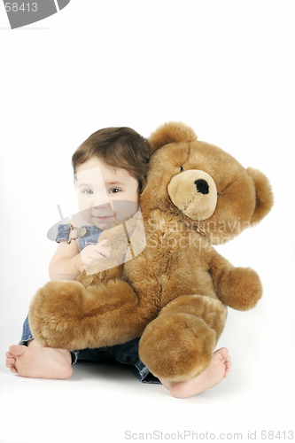 Image of Baby Girl hugging her teddy