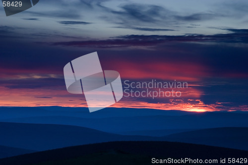 Image of Bloody Sunset over hill terrain