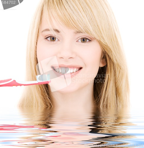 Image of happy girl with toothbrush