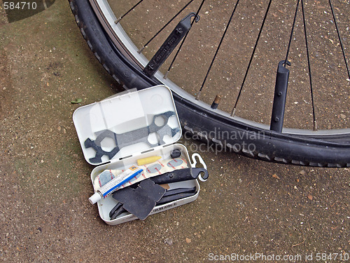 Image of Mending a puncture on a mountain bike.