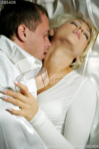 Image of Couple in bed, motion blur