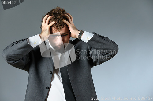 Image of Stressed businessman