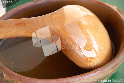 Image of Wooden spoon in earthenware