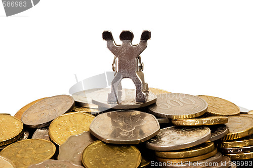 Image of Figurine on top of a pile of coins