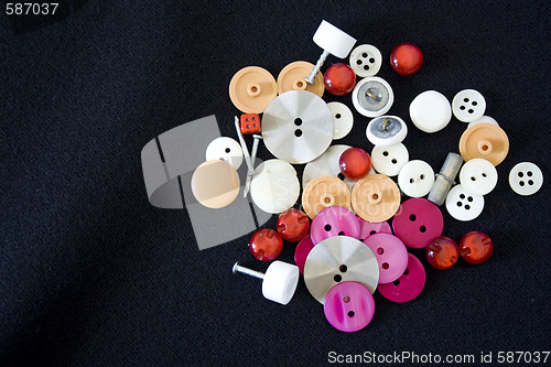 Image of buttons, dice and nails