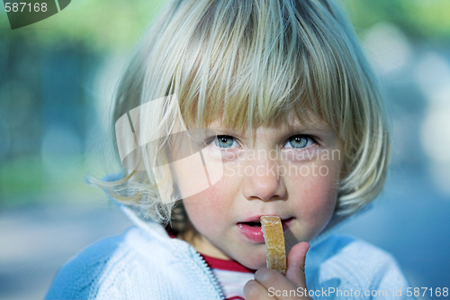 Image of Little girl with bread