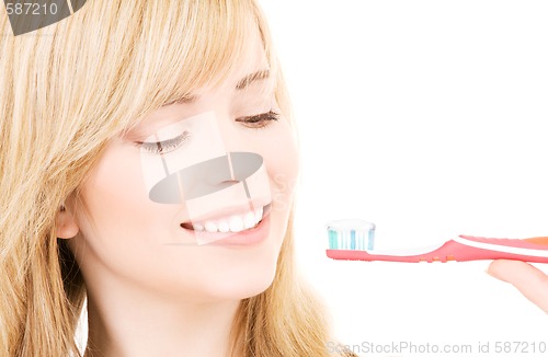 Image of happy girl with toothbrush