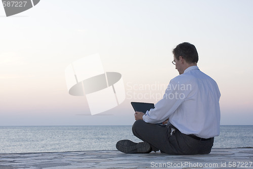 Image of Businessman working with laptop