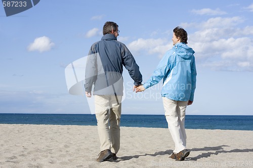 Image of Mid-adult couple on the beach