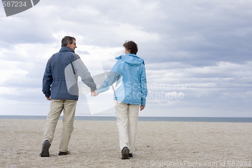 Image of Mid-adult couple on the beach