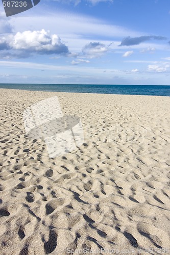 Image of Cloudy sky above a sandy beach