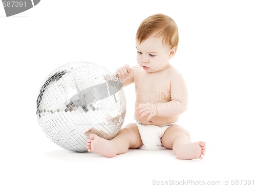 Image of adorable baby boy with big disco ball