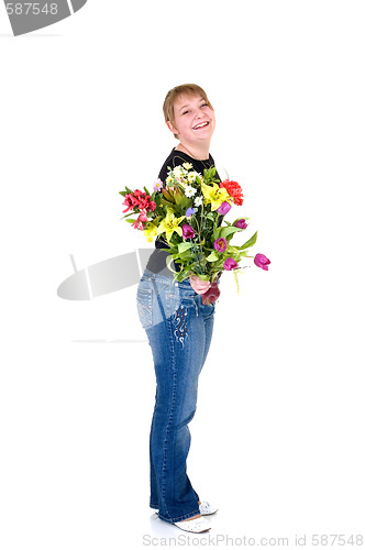 Image of Happy smiling young girl presenting flowers 