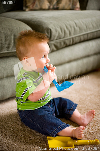 Image of Baby Boy with Toys