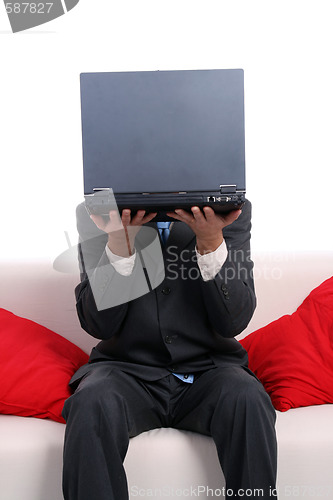 Image of businessman working on the sofa
