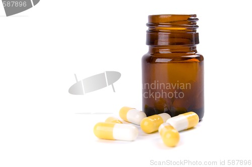 Image of bottle with yellow capsules