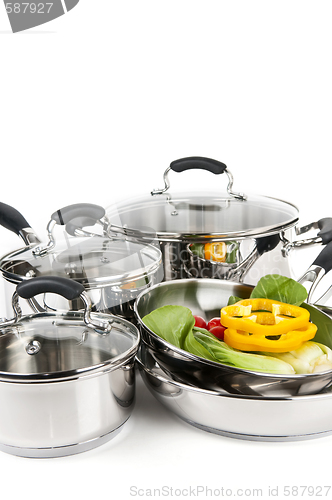 Image of Stainless steel pots and pans with vegetables