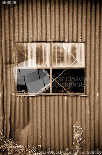 Image of old rusty metal tin shed