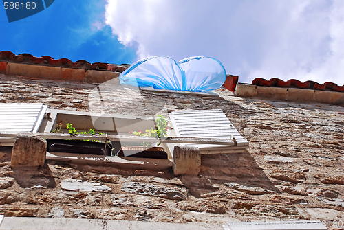 Image of Blue curtain on wind