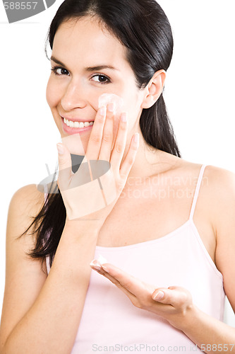 Image of Woman applying lotion