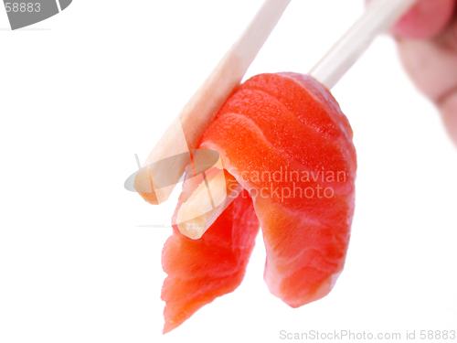 Image of Salmon meat in chopsticks