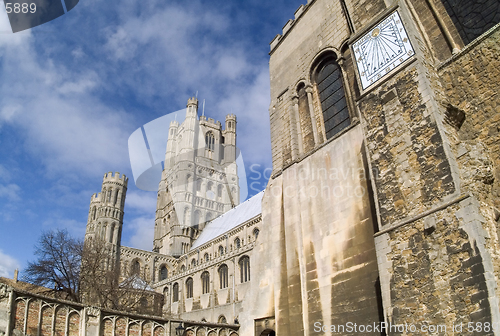 Image of Very wide angle view of west tower of Ely Cathedral, Cambridgeshire, England from the south east, also showing the sundial