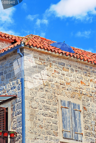 Image of Umbrella on roof. Rain protection