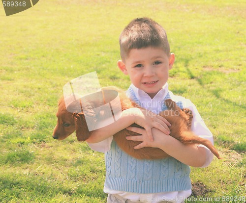 Image of Little boy with his dog