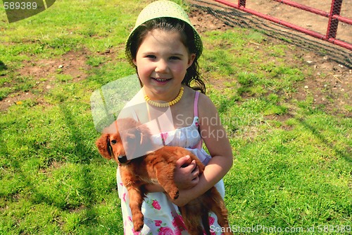 Image of Little girl with puppy