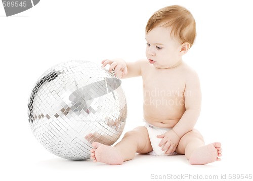 Image of adorable baby boy with big disco ball