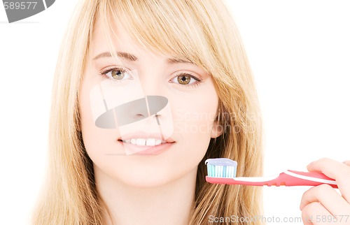 Image of happy girl with toothbrush