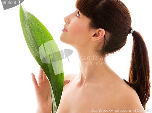 Image of woman with green leaf