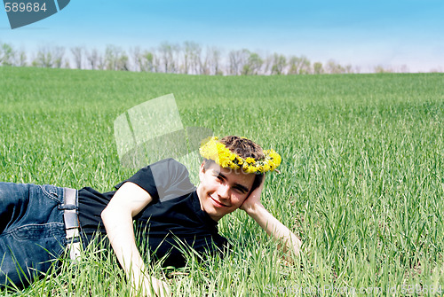 Image of Young man in dandelion crown