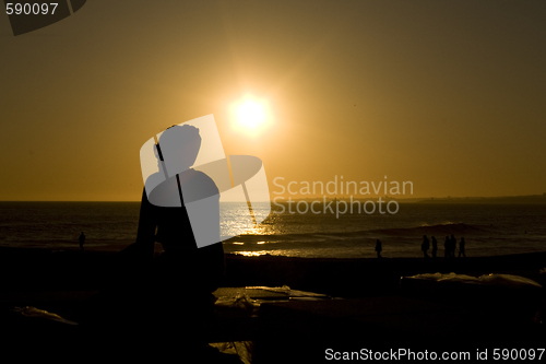 Image of a girl looking to the sunset