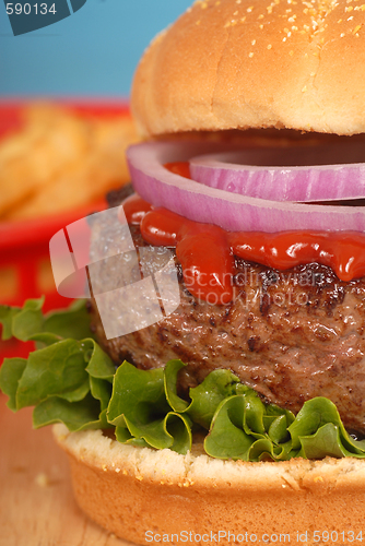 Image of Hamburger with onions and ketchup